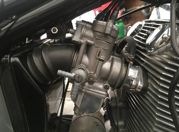 Can you clean a motorcycle carburetor without removing it